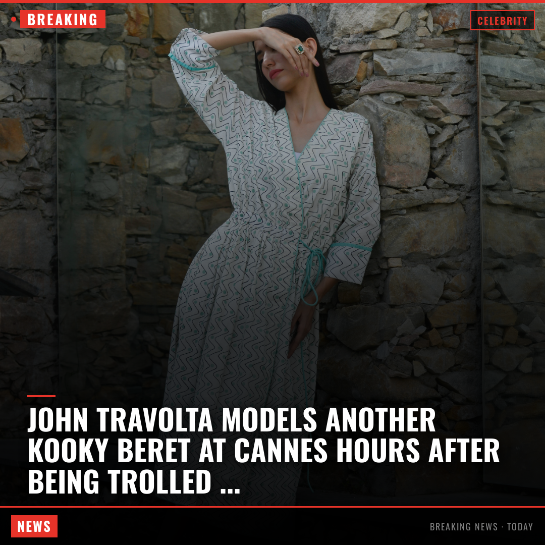 John Travolta models another kooky beret at Cannes hours after being trolled for striking new look